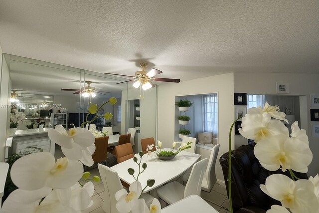 12500 SW 5th Ct Unit 112M, Pembroke Pines, FL 33027 - dining room featuring a textured ceiling and a ceiling fan