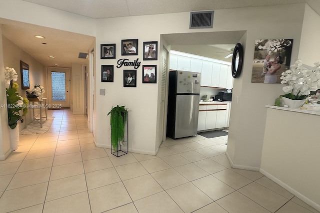 12500 SW 5th Ct Unit 112M, Pembroke Pines, FL 33027 - hallway with light tile patterned flooring and recessed lighting
