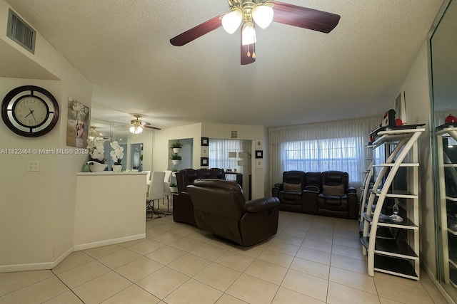 12500 SW 5th Ct Unit 112M, Pembroke Pines, FL 33027 - living room featuring a ceiling fan, light tile patterned floors, and a textured ceiling