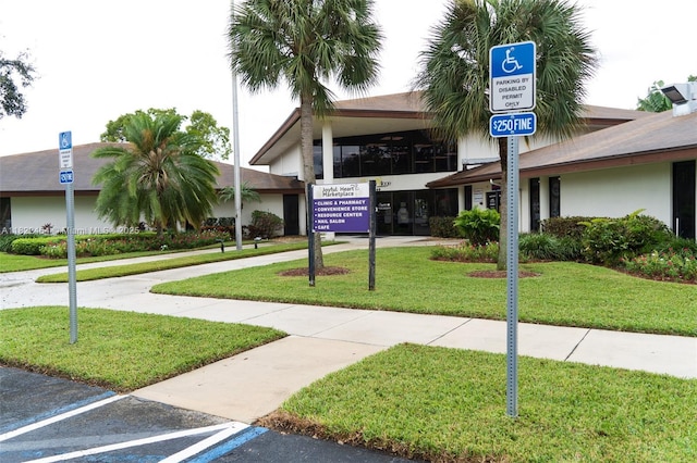 12500 SW 5th Ct Unit 112M, Pembroke Pines, FL 33027 - view of building exterior featuring uncovered parking