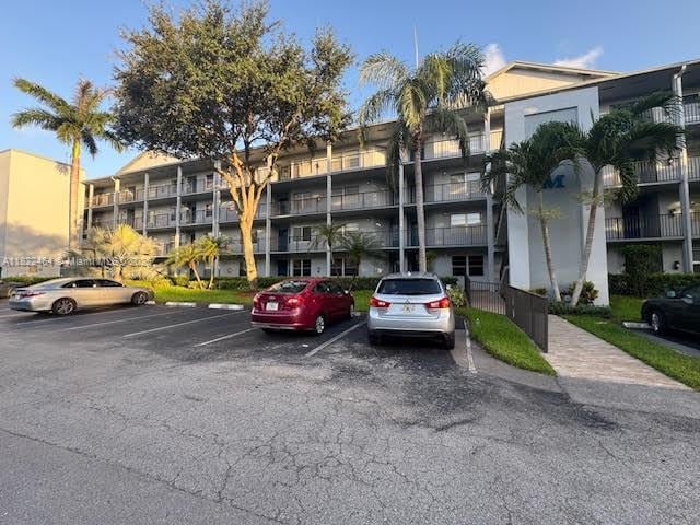 12500 SW 5th Ct Unit 112M, Pembroke Pines, FL 33027 - view of apartment building / complex with uncovered parking