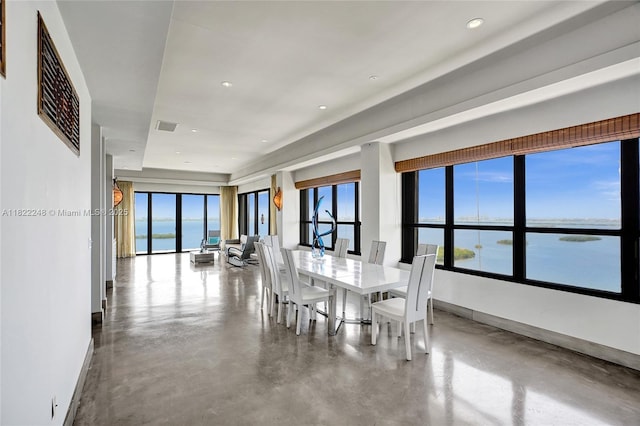 780 NE 69th St Unit T-1A, Miami, FL 33138 - dining room featuring plenty of natural light, finished concrete flooring, a water view, and recessed lighting
