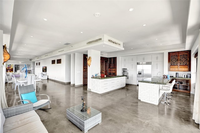 780 NE 69th St Unit T-1A, Miami, FL 33138 - living area featuring finished concrete floors and recessed lighting