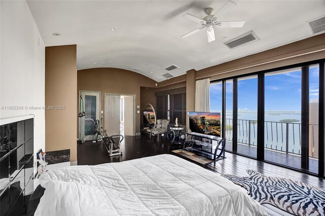 780 NE 69th St Unit T-1A, Miami, FL 33138 - bedroom featuring lofted ceiling, access to outside, and wood finished floors