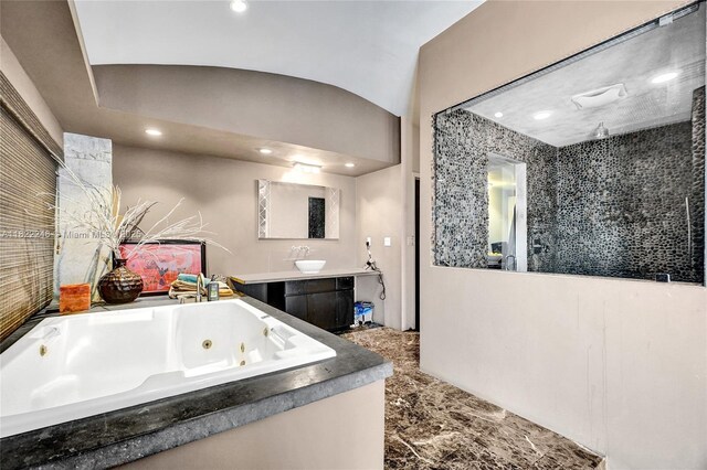 780 NE 69th St Unit T-1A, Miami, FL 33138 - bathroom with recessed lighting, vanity, a whirlpool tub, and marble tiled floors