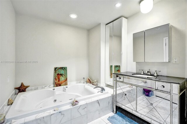 780 NE 69th St Unit T-1A, Miami, FL 33138 - full bathroom featuring a whirlpool tub, vanity, recessed lighting, and tile patterned floors