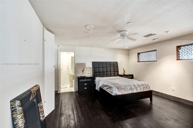 780 NE 69th St Unit T-1A, Miami, FL 33138 - bedroom with dark wood-style floors, ensuite bath, and ceiling fan