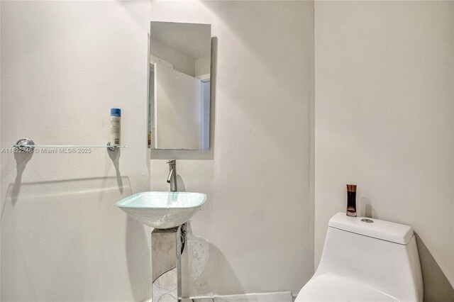 780 NE 69th St Unit T-1A, Miami, FL 33138 - bathroom featuring toilet