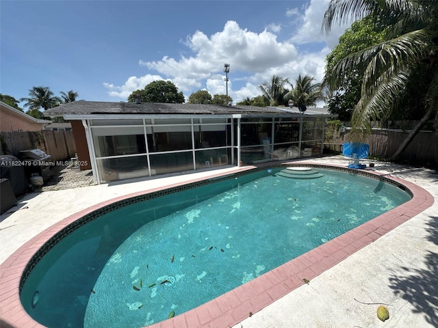 6211 SW 9th Pl, North Lauderdale, FL 33068 - view of pool featuring a fenced backyard, a patio, a sunroom, and a grill