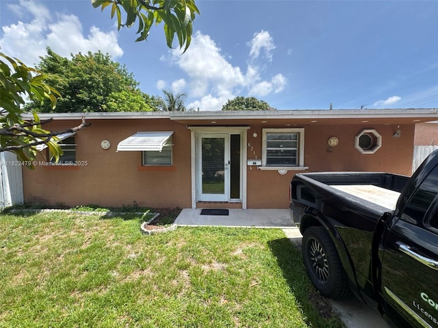 6211 SW 9th Pl, North Lauderdale, FL 33068 - view of front facade with stucco siding and a front yard