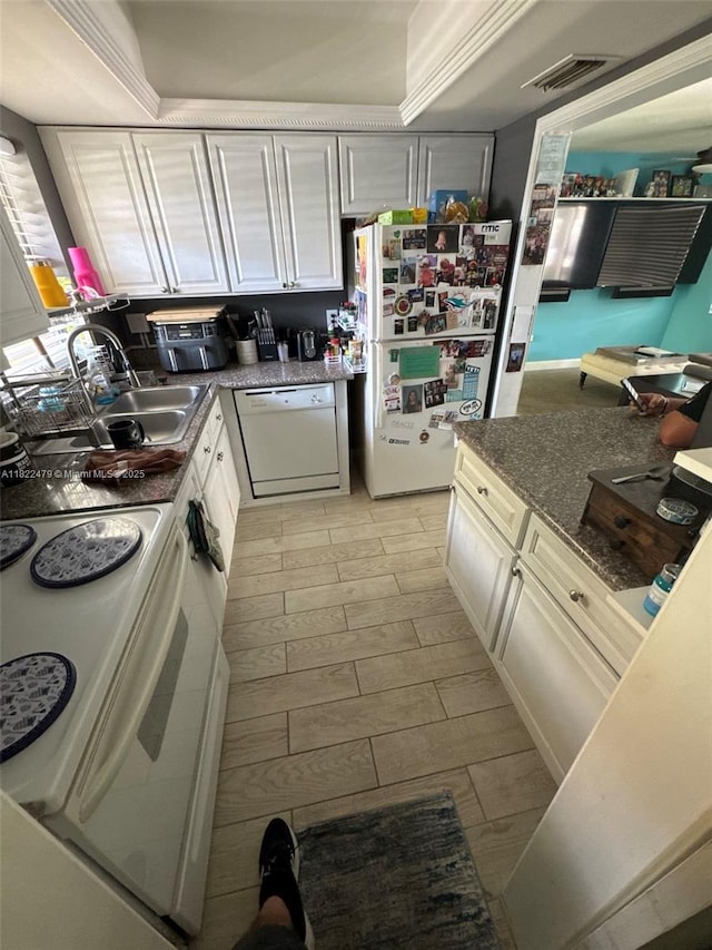 6211 SW 9th Pl, North Lauderdale, FL 33068 - kitchen with white appliances, dark stone countertops, and white cabinets