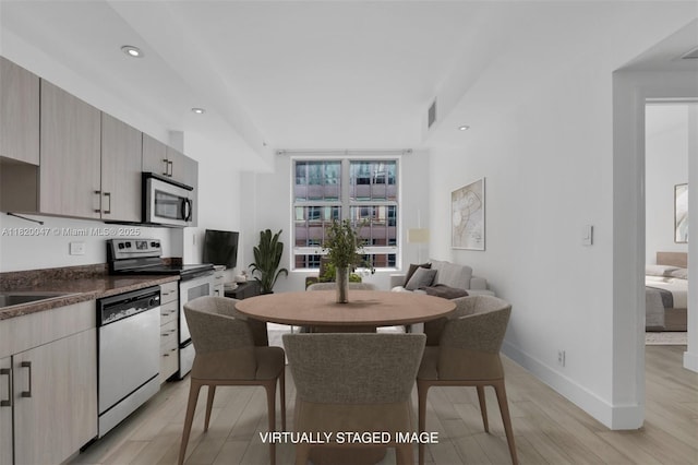 111 E Flagler St Unit 902, Miami, FL 33131 - dining area with light wood-type flooring and recessed lighting
