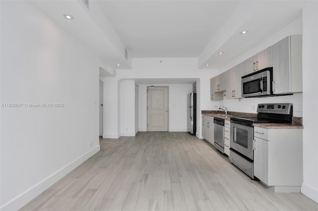 111 E Flagler St Unit 902, Miami, FL 33131 - kitchen featuring appliances with stainless steel finishes, recessed lighting, and light wood finished floors