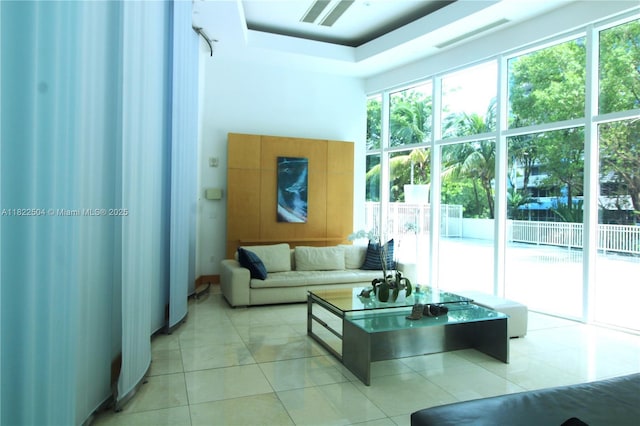2101 Brickell Ave Unit 1711, Miami, FL 33129 - living area with light tile patterned floors and a tray ceiling