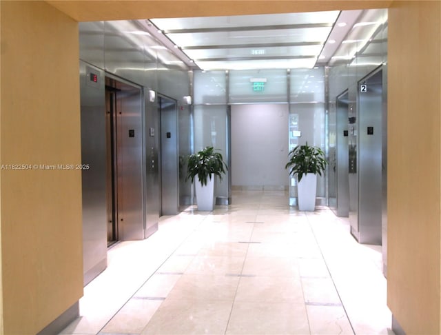 2101 Brickell Ave Unit 1711, Miami, FL 33129 - hallway featuring elevator and tile patterned floors
