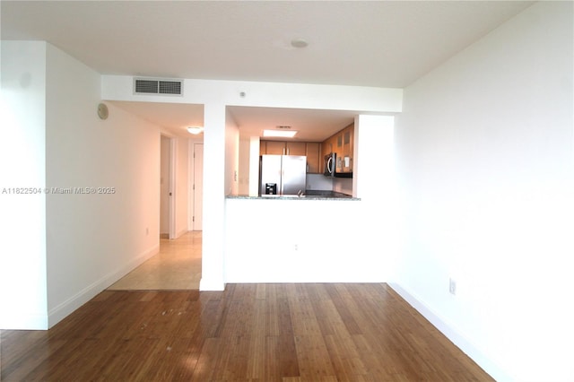 2101 Brickell Ave Unit 1711, Miami, FL 33129 - unfurnished living room with dark wood-type flooring and baseboards