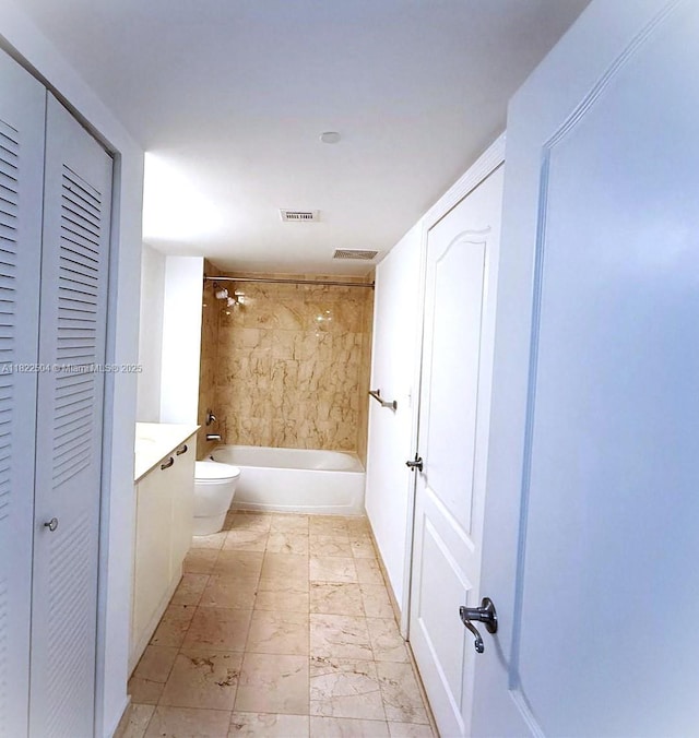 2101 Brickell Ave Unit 1711, Miami, FL 33129 - full bathroom with a closet, marble look tiles, washtub / shower combination, and vanity