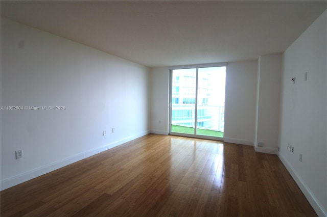 2101 Brickell Ave Unit 1711, Miami, FL 33129 - empty room featuring wood finished floors and baseboards