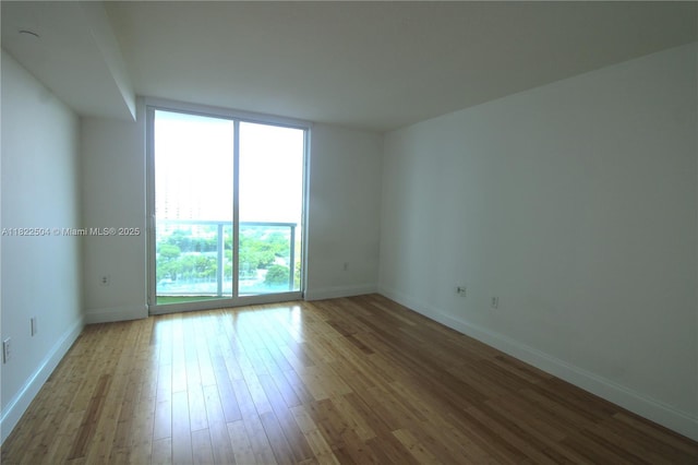 2101 Brickell Ave Unit 1711, Miami, FL 33129 - spare room with wood finished floors and baseboards