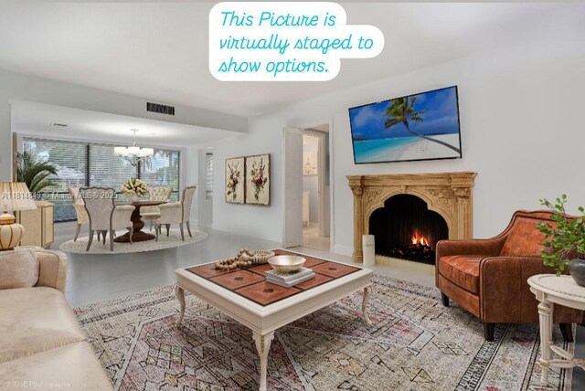 4650 Kittiwake Ct Unit 4650, Boynton Beach, FL 33436 - living room with a chandelier and a lit fireplace