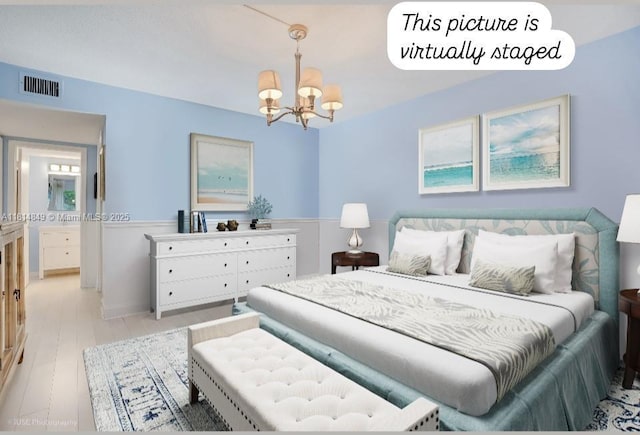 4650 Kittiwake Ct Unit 4650, Boynton Beach, FL 33436 - bedroom with a chandelier and light wood-type flooring