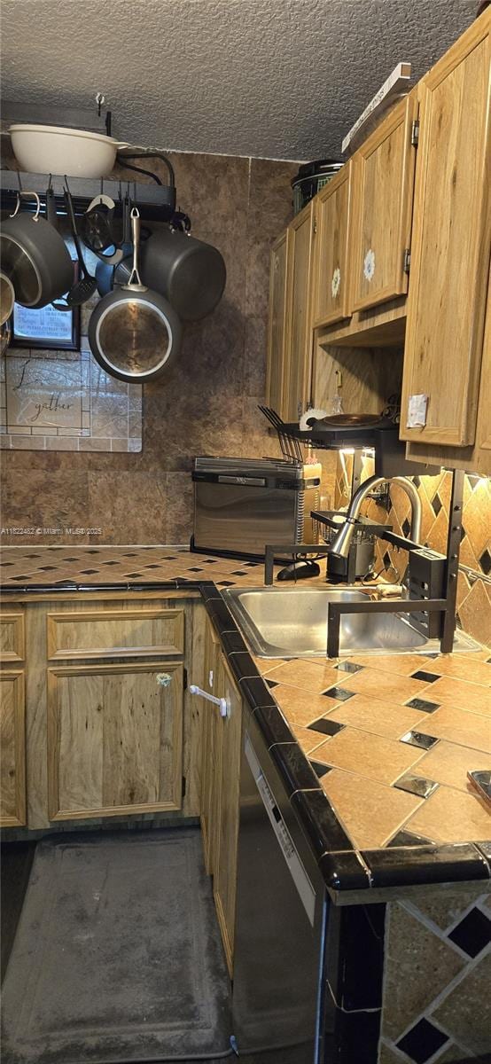 9750 NW 14th St Unit 30-5, Coral Springs, FL 33071 - kitchen with black dishwasher and brown cabinetry