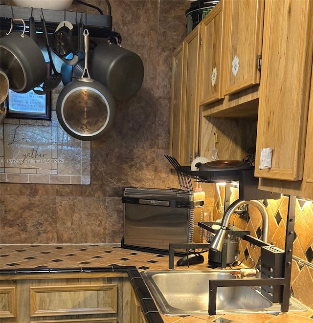 9750 NW 14th St Unit 30-5, Coral Springs, FL 33071 - kitchen featuring decorative backsplash and a sink