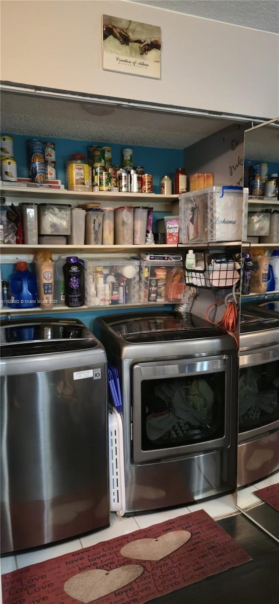 9750 NW 14th St Unit 30-5, Coral Springs, FL 33071 - pantry featuring washer and dryer