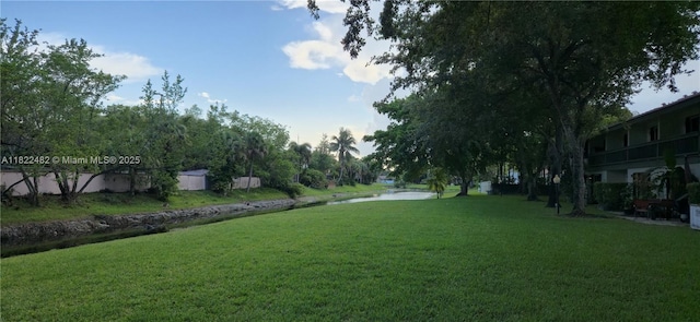 9750 NW 14th St Unit 30-5, Coral Springs, FL 33071 - view of grassy yard featuring a water view