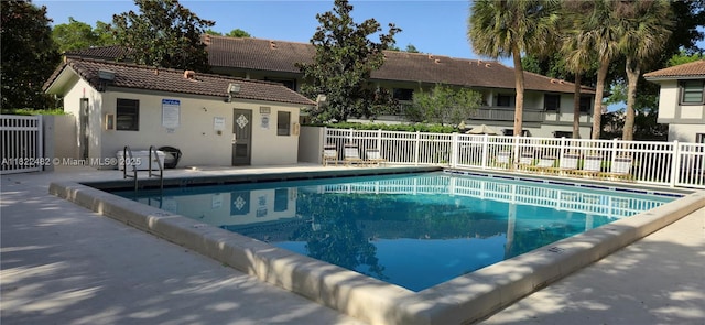 9750 NW 14th St Unit 30-5, Coral Springs, FL 33071 - community pool featuring a patio area