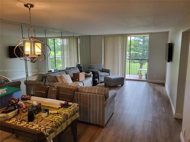 3150 W Rolling Hills Cir Unit 310, Davie, FL 33328 - living room featuring dark wood finished floors, a chandelier, and floor to ceiling windows