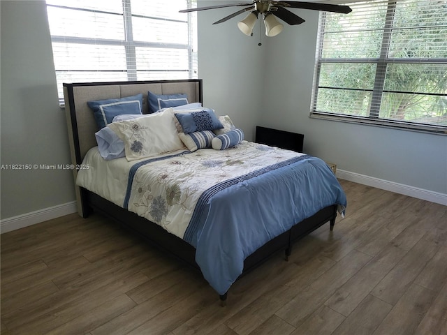 3150 W Rolling Hills Cir Unit 310, Davie, FL 33328 - bedroom featuring wood finished floors and a ceiling fan