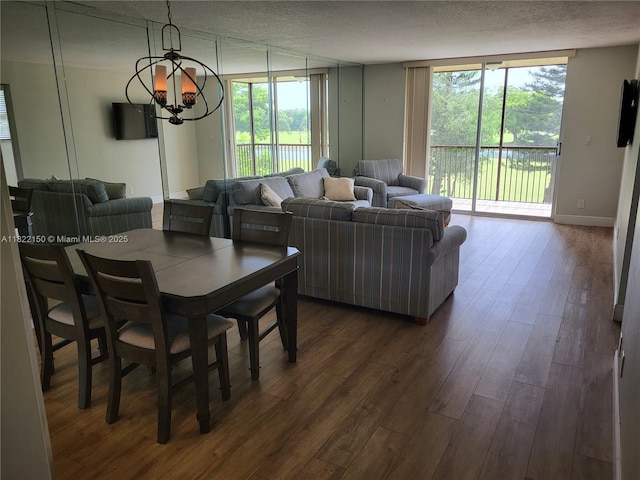 3150 W Rolling Hills Cir Unit 310, Davie, FL 33328 - dining space featuring dark wood-style flooring, a chandelier, a textured ceiling, and healthy amount of natural light