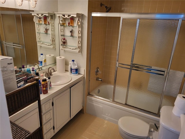 3150 W Rolling Hills Cir Unit 310, Davie, FL 33328 - bathroom featuring vanity, tile patterned flooring, and combined bath / shower with glass door
