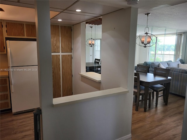 3150 W Rolling Hills Cir Unit 310, Davie, FL 33328 - kitchen featuring freestanding refrigerator, a chandelier, recessed lighting, wood finished floors, and hanging light fixtures