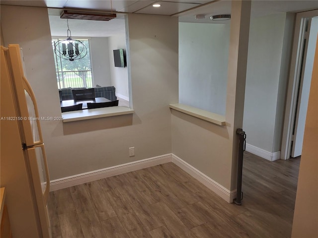 3150 W Rolling Hills Cir Unit 310, Davie, FL 33328 - empty room featuring a chandelier, wood finished floors, and recessed lighting