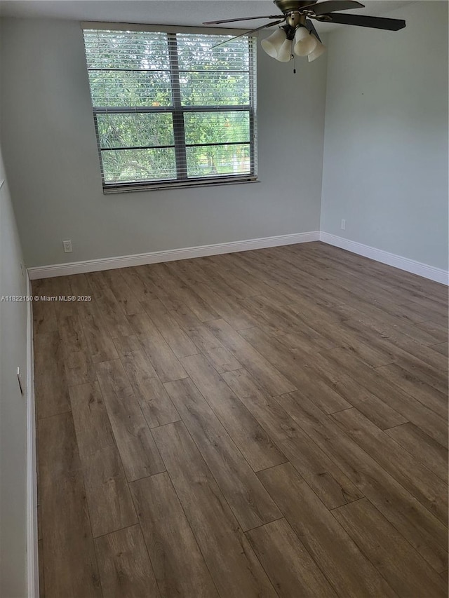 3150 W Rolling Hills Cir Unit 310, Davie, FL 33328 - empty room with dark wood finished floors, a ceiling fan, and plenty of natural light