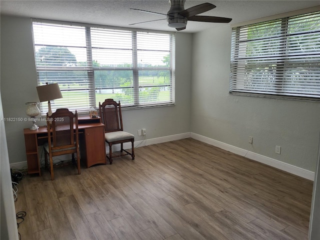 3150 W Rolling Hills Cir Unit 310, Davie, FL 33328 - office area with a ceiling fan, wood finished floors, and a textured ceiling