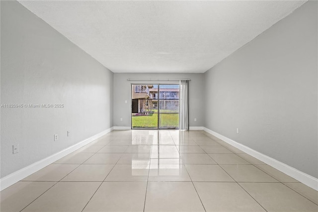 301 NW 177th St Unit 104, Miami Gardens, FL 33169 - unfurnished room featuring light tile patterned flooring and a textured ceiling