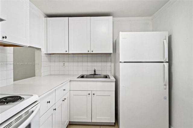 301 NW 177th St Unit 104, Miami Gardens, FL 33169 - kitchen featuring white appliances, white cabinets, light countertops, and backsplash