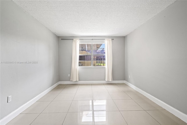 301 NW 177th St Unit 104, Miami Gardens, FL 33169 - unfurnished room with a textured ceiling and light tile patterned floors
