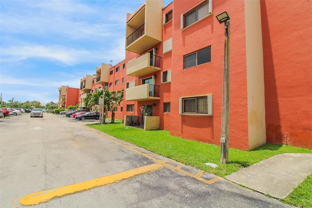 8095 NW 8th St Unit 209, Miami, FL 33126 - view of building exterior featuring uncovered parking