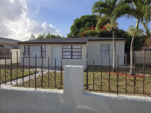 257 E 38th St, Hialeah, FL 33013 - single story home with a fenced front yard and stucco siding