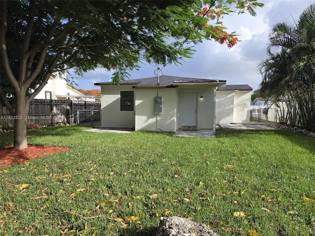 257 E 38th St, Hialeah, FL 33013 - rear view of property with stucco siding