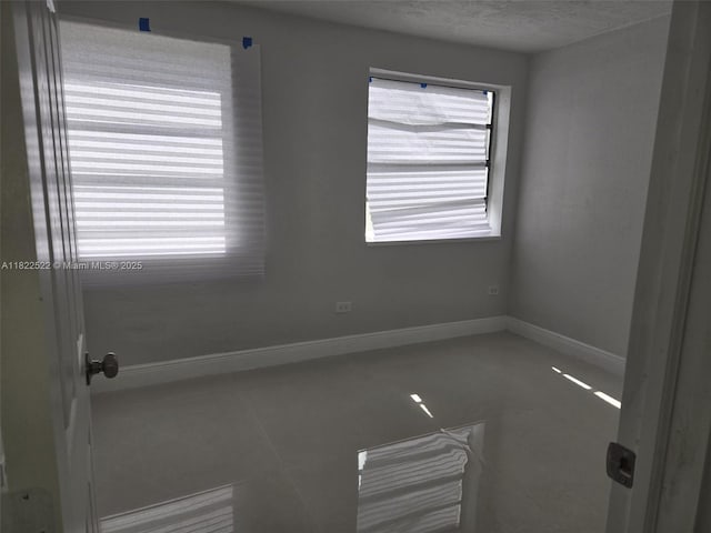 257 E 38th St, Hialeah, FL 33013 - spare room with baseboards