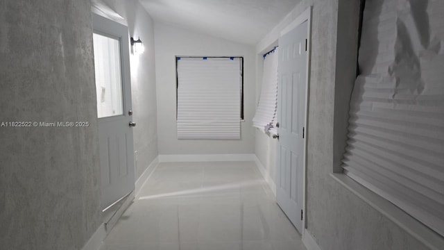 257 E 38th St, Hialeah, FL 33013 - bathroom featuring lofted ceiling and tile patterned floors