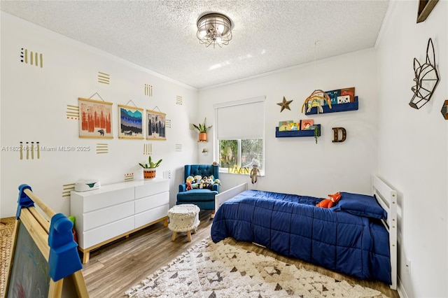 1745 NW 77th Ave, Pembroke Pines, FL 33024 - bedroom featuring wood finished floors, a textured ceiling, and ornamental molding