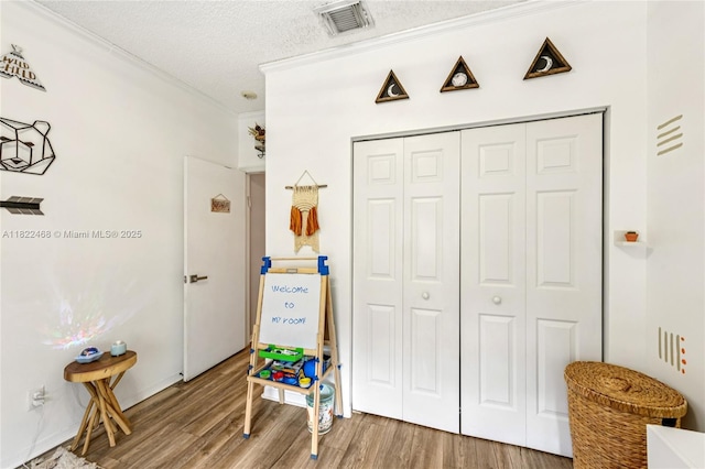 1745 NW 77th Ave, Pembroke Pines, FL 33024 - interior space featuring wood finished floors, a textured ceiling, and crown molding