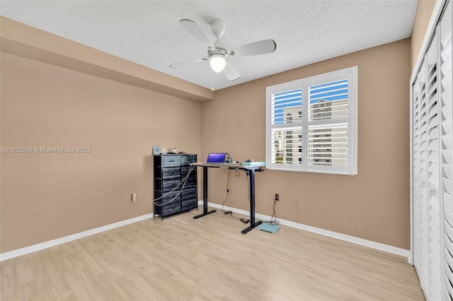 17100 N Bay Rd Unit 1904, Sunny Isles Beach, FL 33160 - home office with a ceiling fan, wood finished floors, and a textured ceiling