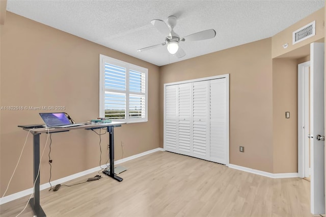 17100 N Bay Rd Unit 1904, Sunny Isles Beach, FL 33160 - unfurnished office featuring light wood-style floors, a ceiling fan, and a textured ceiling
